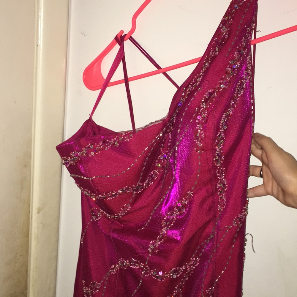 Pink one-shoulder dress.